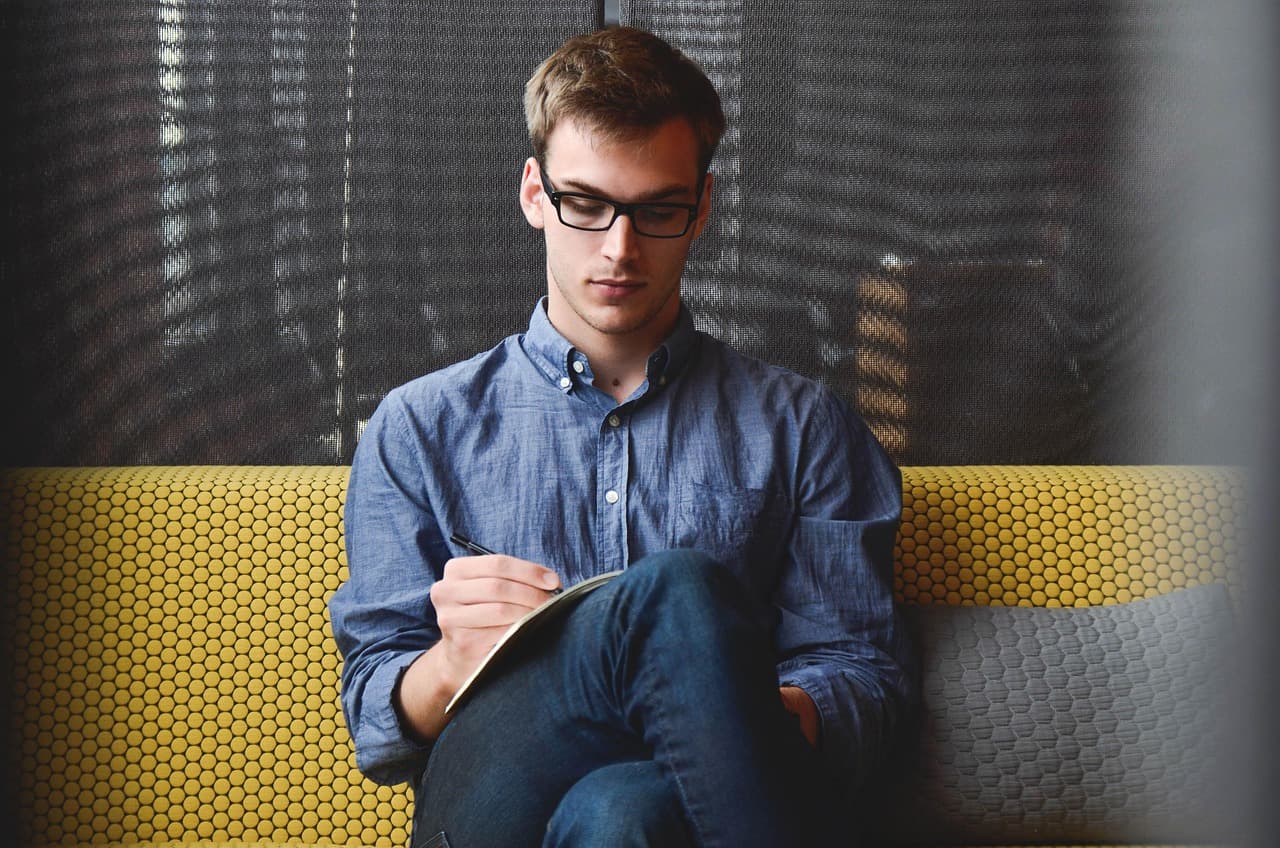 Person reviewing figures at a desk, representing cost modelling for AI inference spend