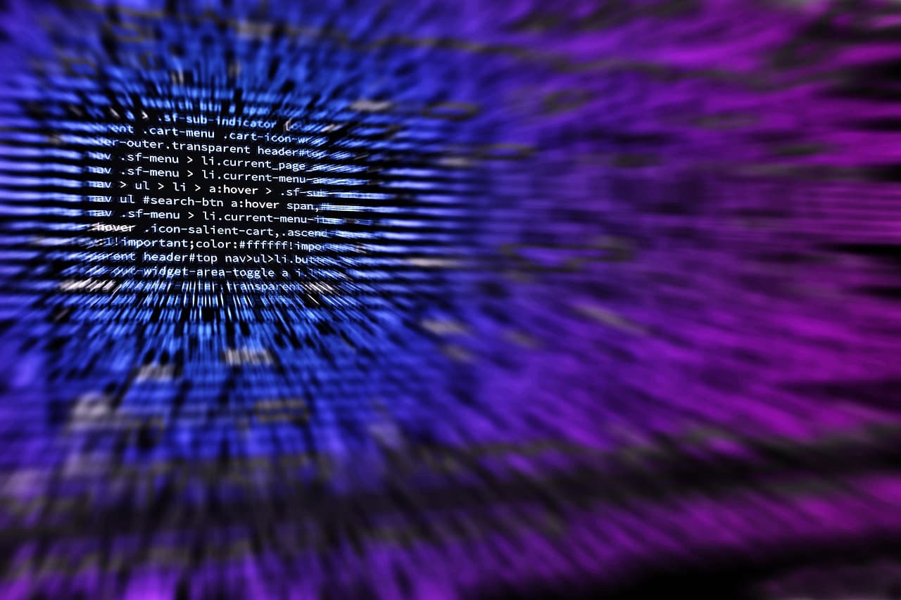 Dark screen filled with code, representing autonomous vulnerability discovery