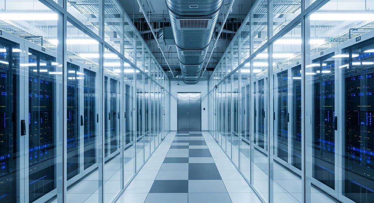Rows of blue-lit server racks in a modern data center